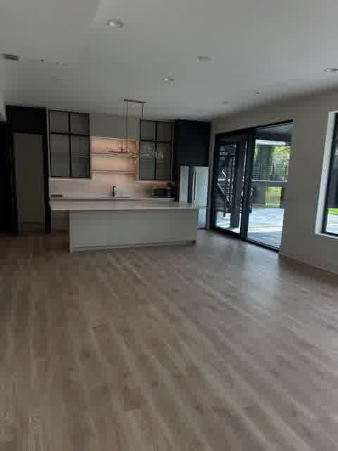 Modern open kitchen with glass-front cabinets and island, Oak Brook